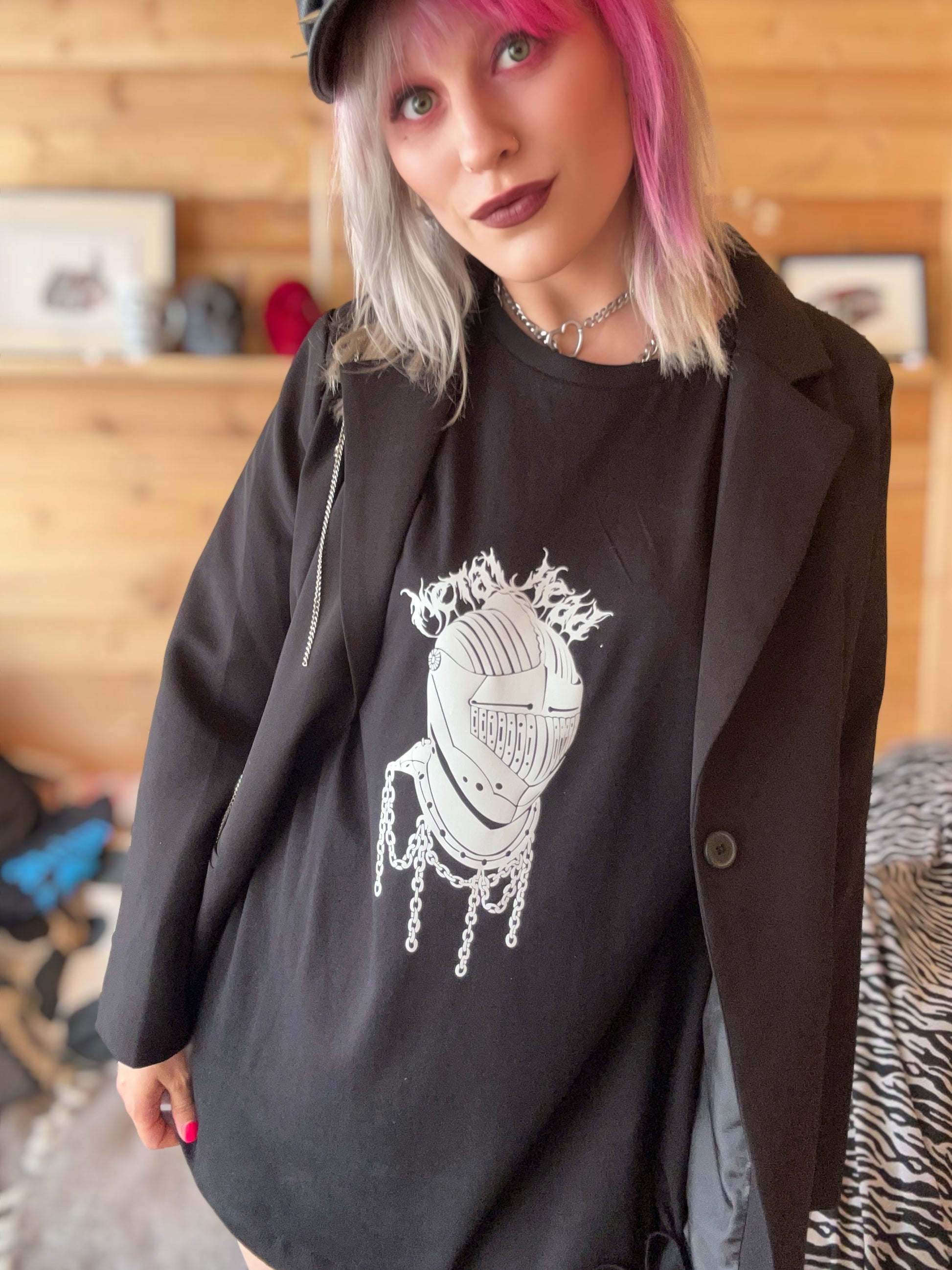 Female, pink hair wearing metal head T-shirt with blazer style jacket 