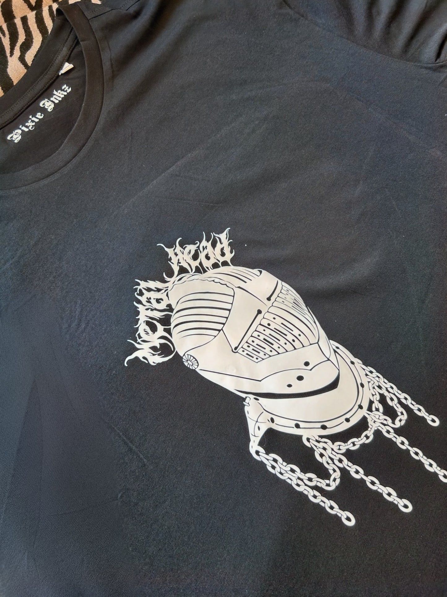 A photo of the metal head T-shirt close up 