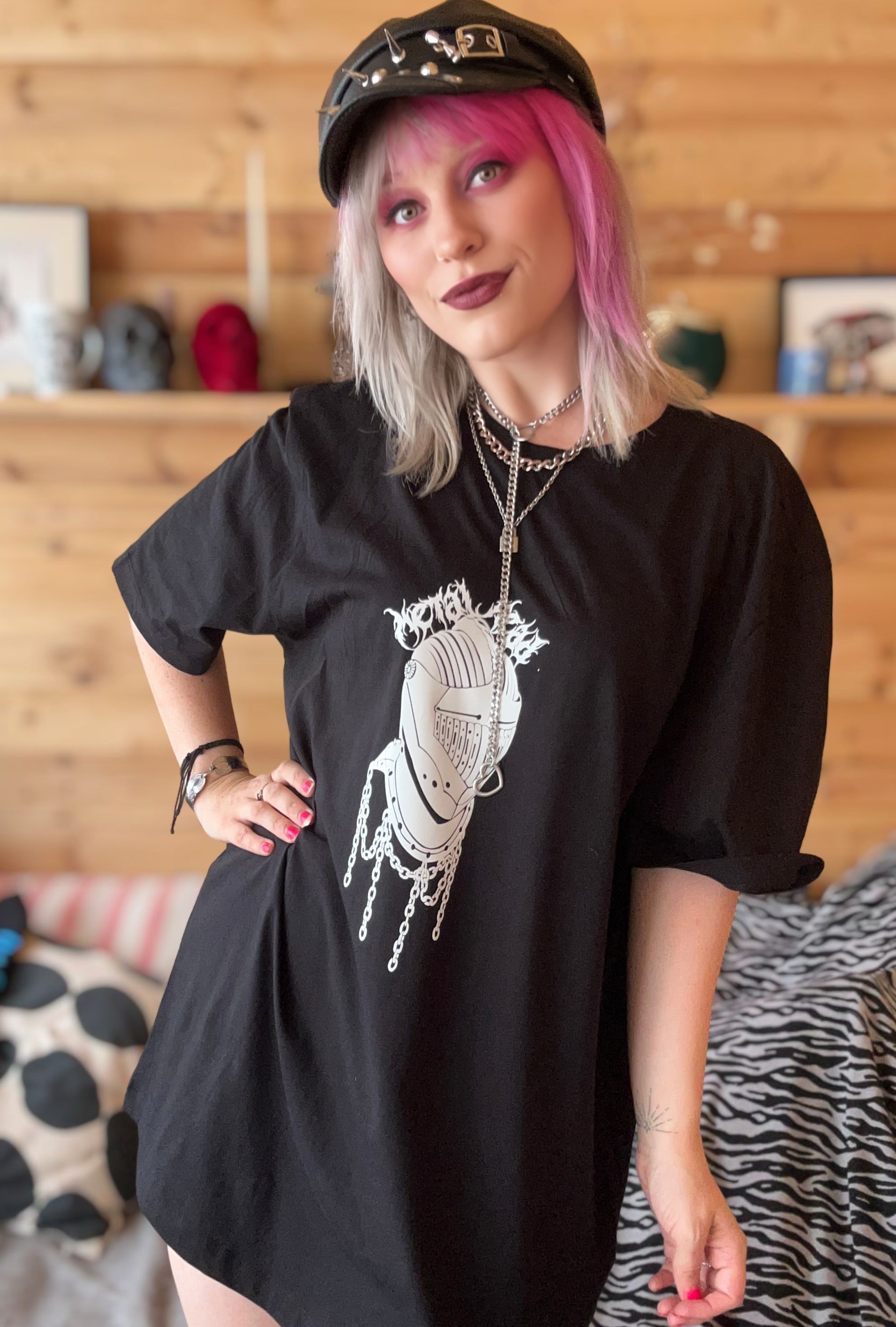 Female with pink hair wearing metal head T-shirt 