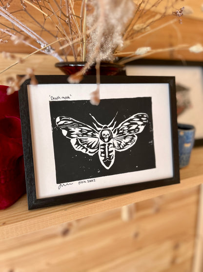 Photo of a moth Lino print in a frame 